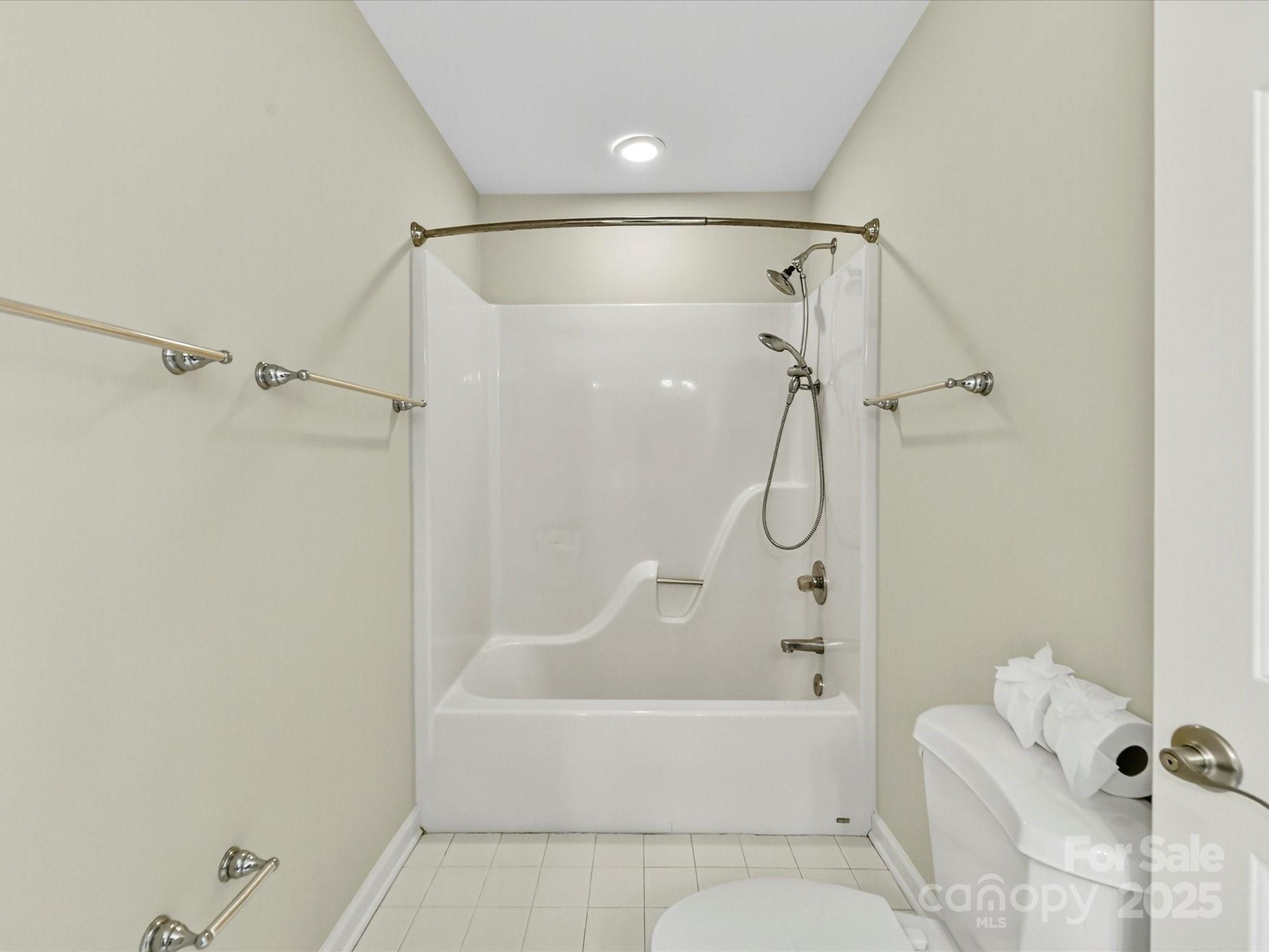 21410 Pinecrest Place Cornelius, NC 28031 - Photo 29 of 43 a bathroom with a shower and a bath tub