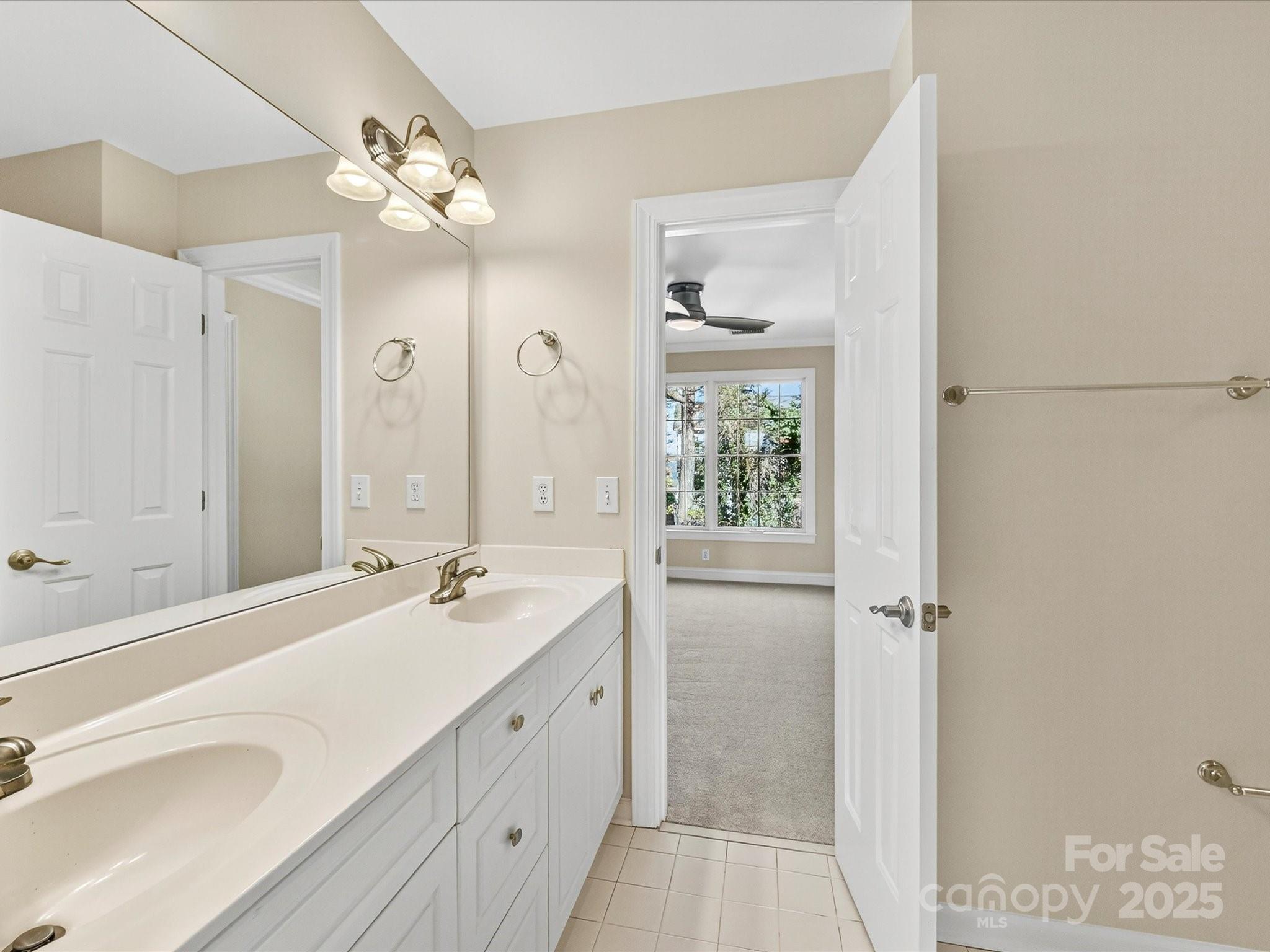 21410 Pinecrest Place Cornelius, NC 28031 - Photo 30 of 43 a bathroom with a double vanity sink mirror and double