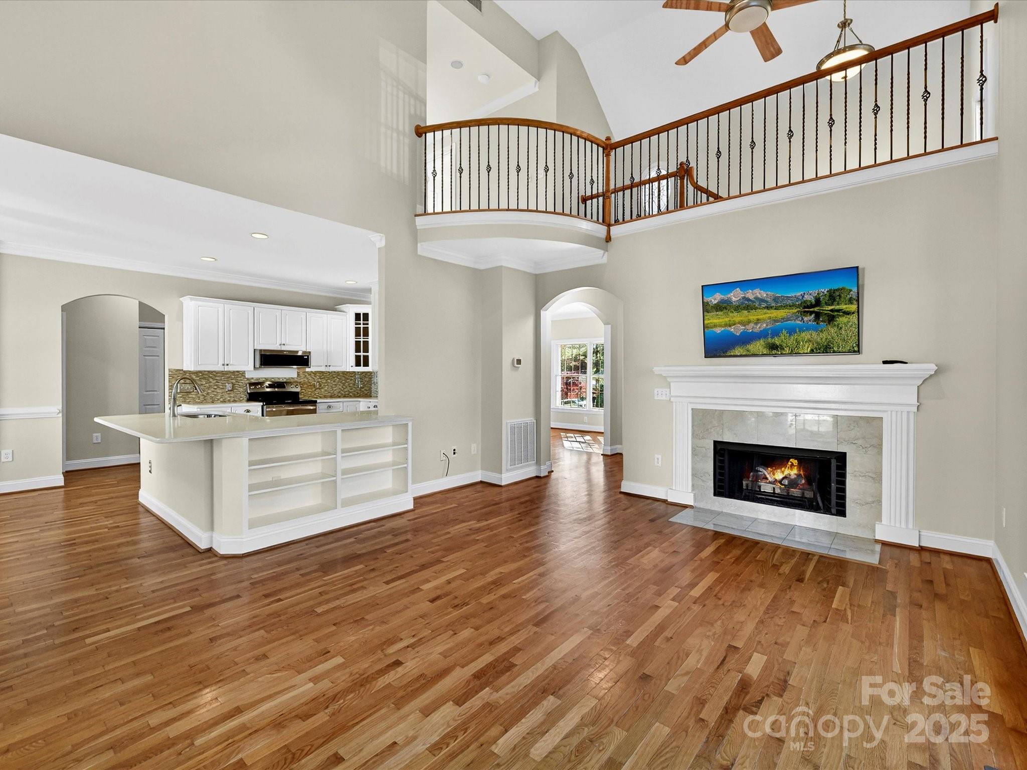 21410 Pinecrest Place Cornelius, NC 28031 - Photo 9 of 43 a view of kitchen with furniture and a fireplace