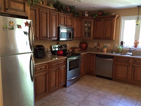 240 Pleasantdale Road Rutland, MA 01543 - Photo 3 of 25 a kitchen with stainless steel appliances granite countertop a sink stove and microwave
