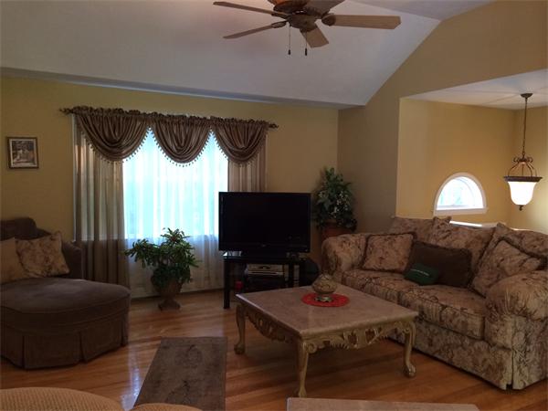 240 Pleasantdale Road Rutland, MA 01543 - Photo 6 of 25 a living room with furniture and a flat screen tv