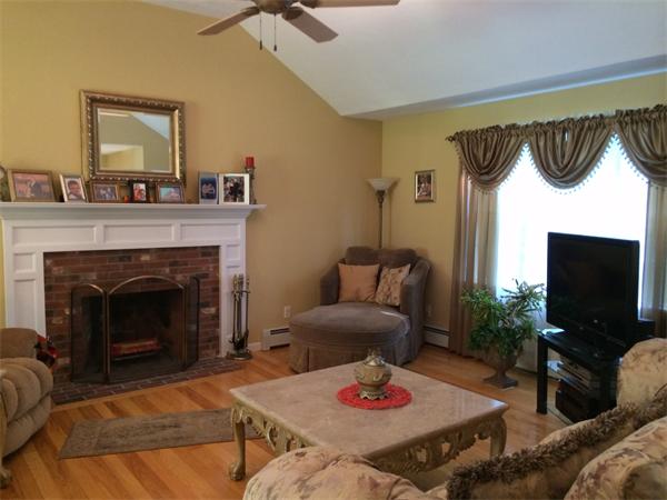 240 Pleasantdale Road Rutland, MA 01543 - Photo 8 of 25 a living room with furniture and a fireplace