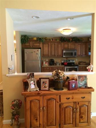 240 Pleasantdale Road Rutland, MA 01543 - Photo 10 of 25 a kitchen with stainless steel appliances granite countertop a sink and cabinets