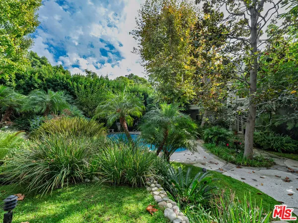 a backyard of a house with lots of green space