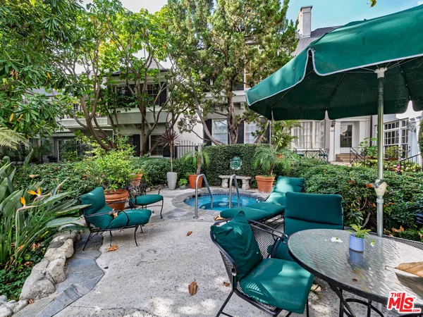 a view of patio with chairs and tables