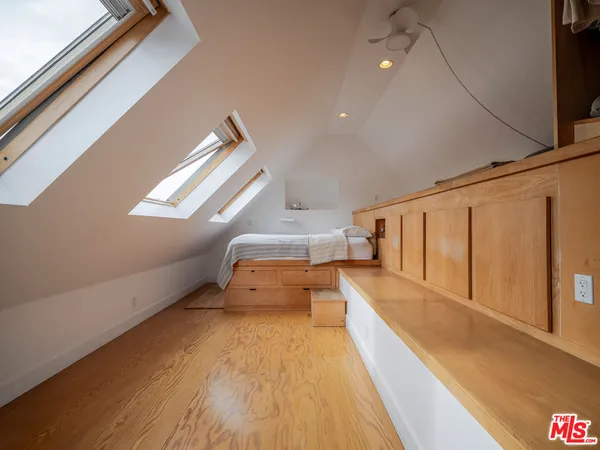 a view of a kitchen with a sink and wooden floor