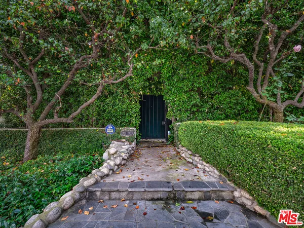 a house view with a garden space