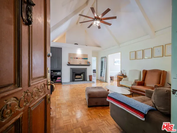a living room with furniture fireplace and a flat screen tv