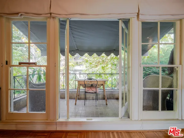 a view of a living room and window