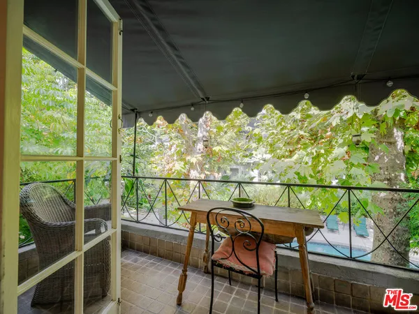 a balcony with chairs