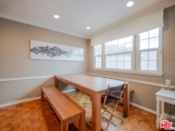 a view of a dining room with furniture and window