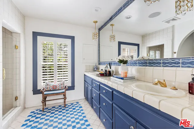 a bathroom with a bathtub and shower