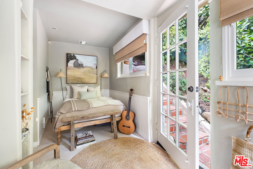 175 West Channel Road Santa Monica, CA 90402 - Photo 21 of 27 a bedroom with furniture and a window