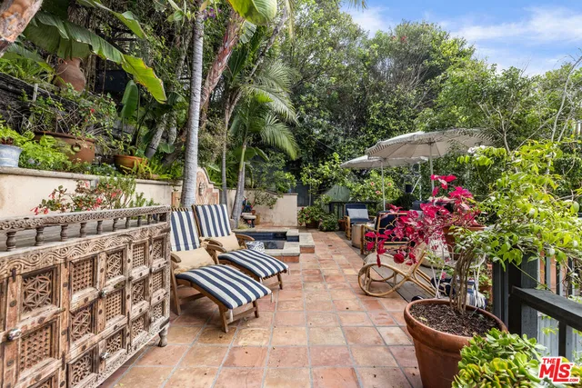 swimming pool view with a seating space