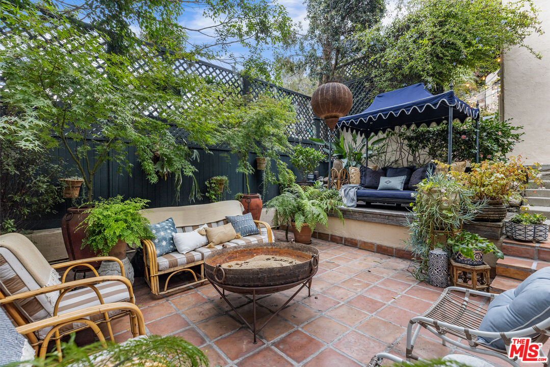 175 West Channel Road Santa Monica, CA 90402 - Photo 25 of 27 a view of a backyard with furniture and a garden