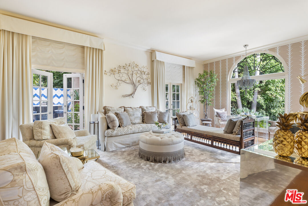175 West Channel Road Santa Monica, CA 90402 - Photo 3 of 27 a living room with furniture and a large window