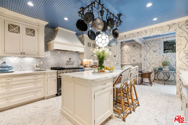 a kitchen with a stove cabinets and a stove