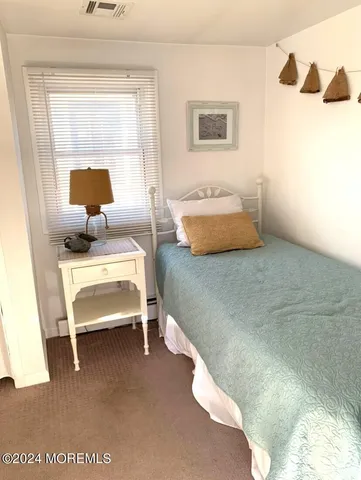 a bedroom with furniture and window