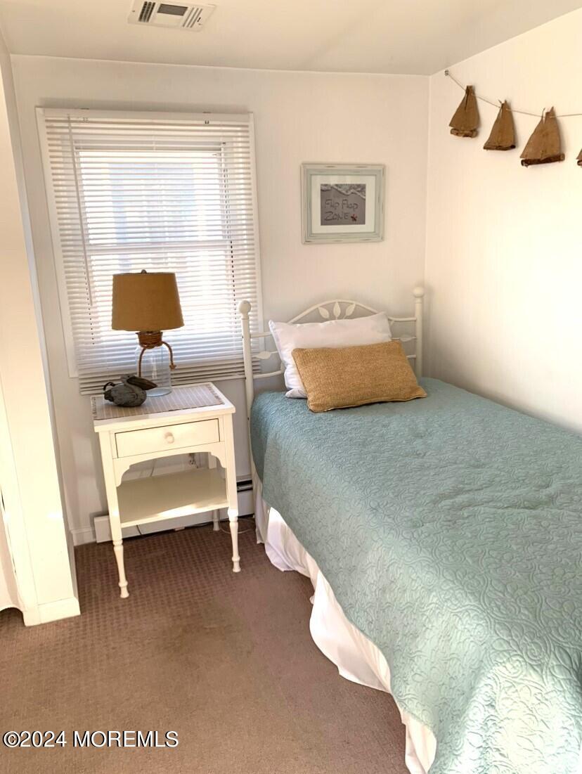 66 1st Avenue Manasquan, NJ 08736 - Photo 6 of 14 a bedroom with furniture and window