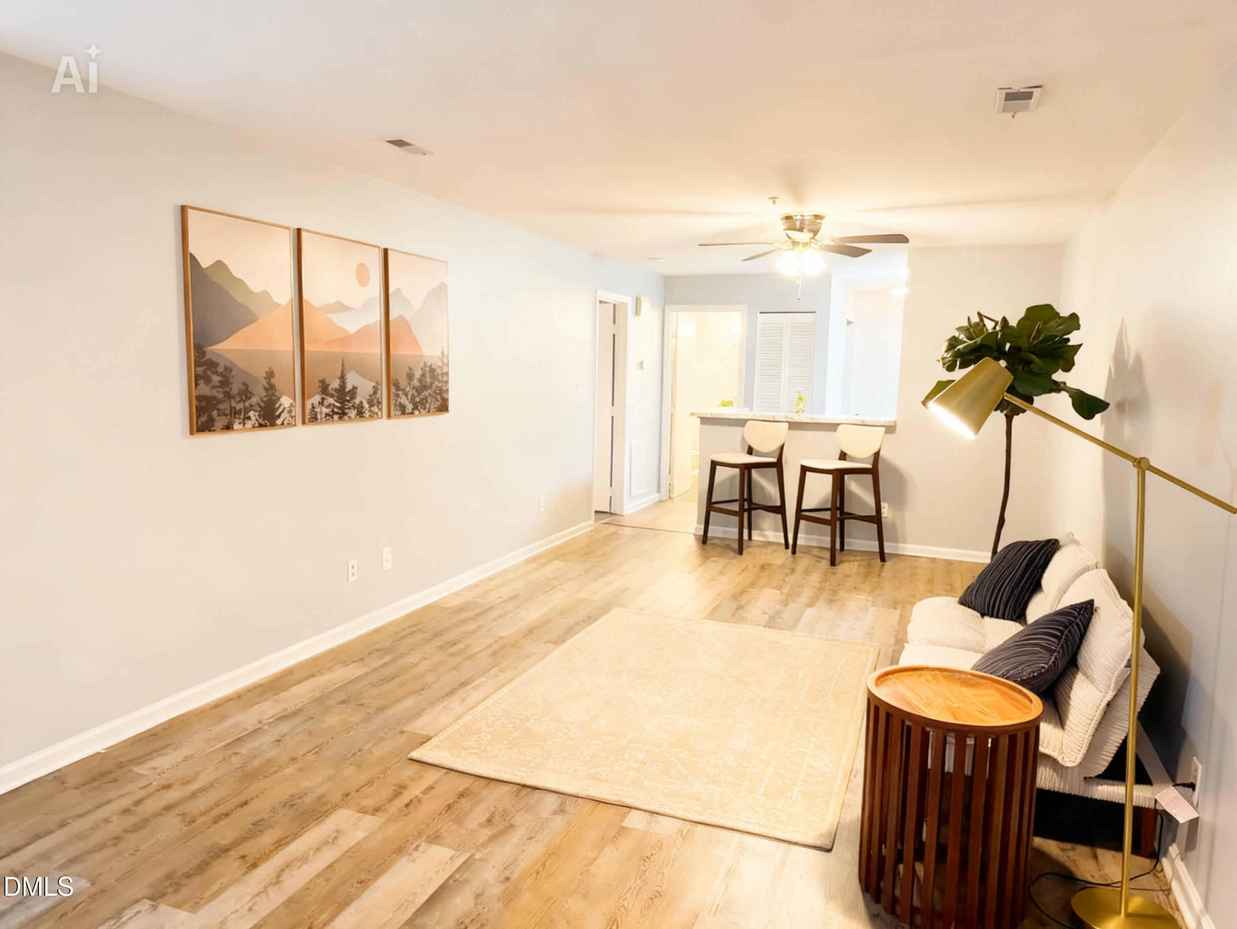 a living room with fireplace furniture and a wooden floor