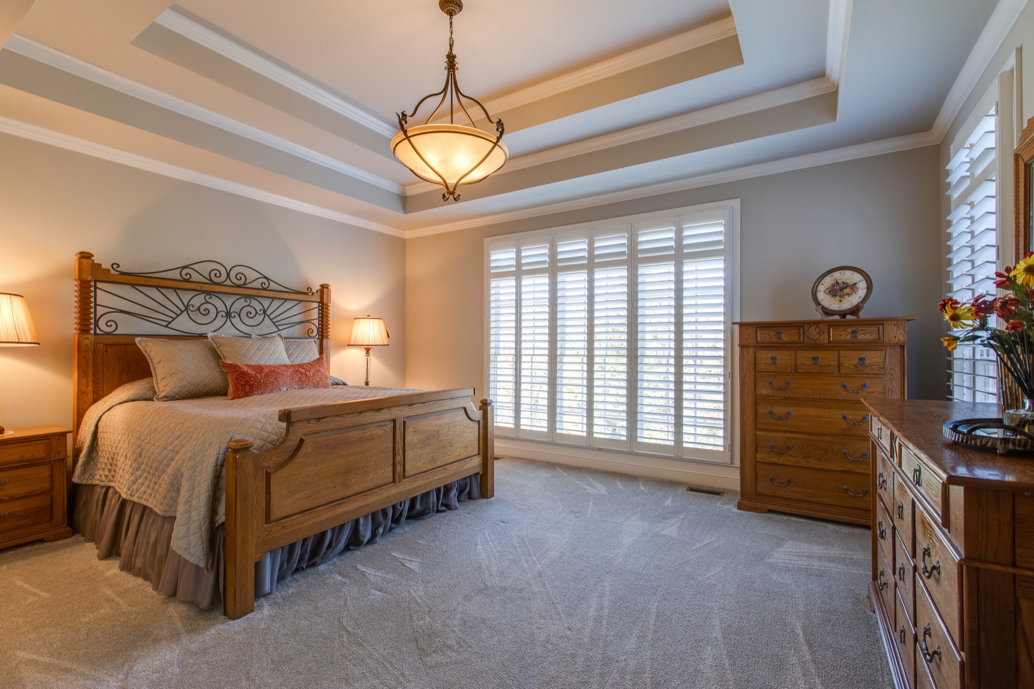 1106 Cedarview Lane Franklin, TN 37067 - Photo 13 of 28 a spacious bedroom with a bed and a chandelier