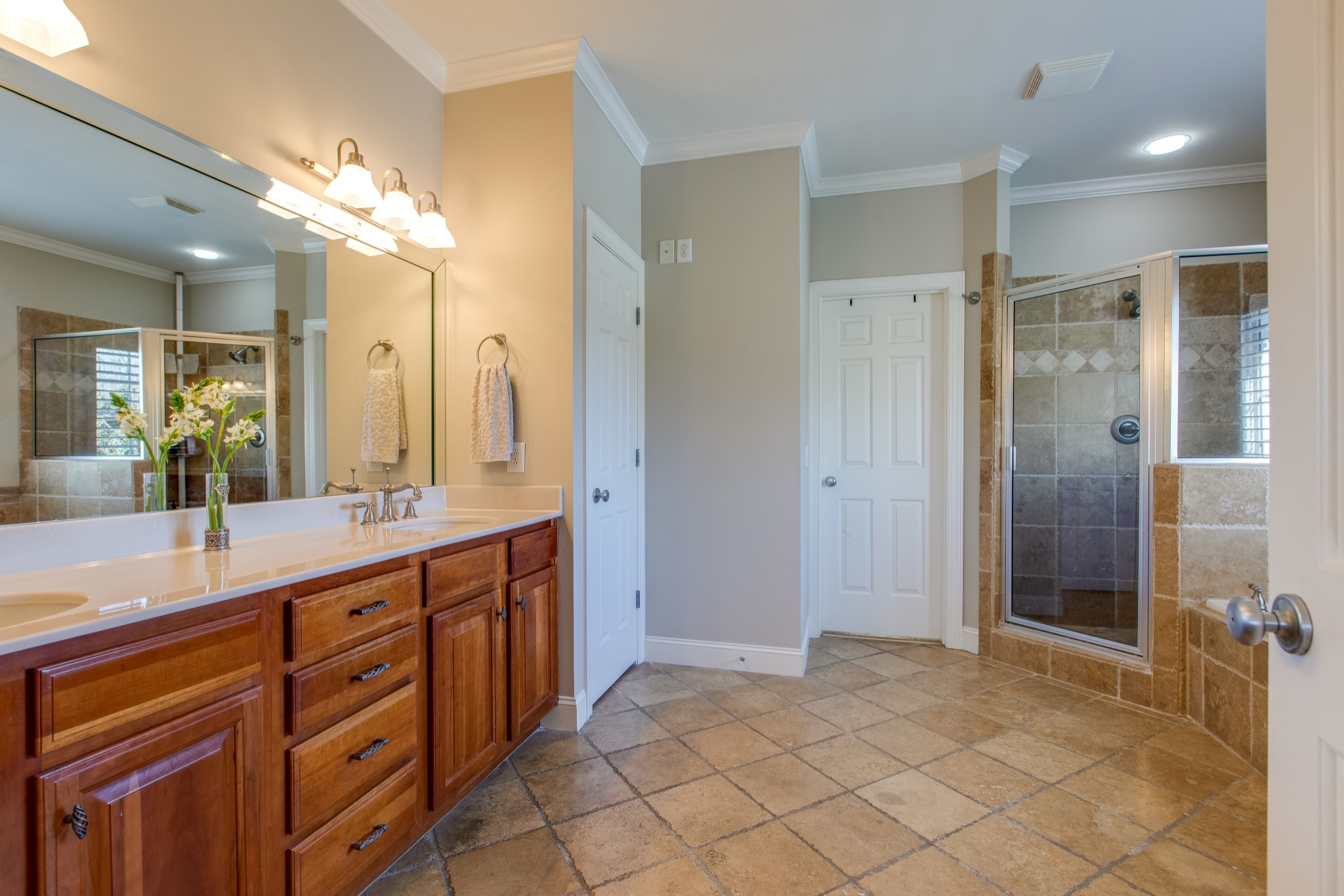 1106 Cedarview Lane Franklin, TN 37067 - Photo 14 of 28 a spacious bathroom with a granite countertop sink mirror and shower