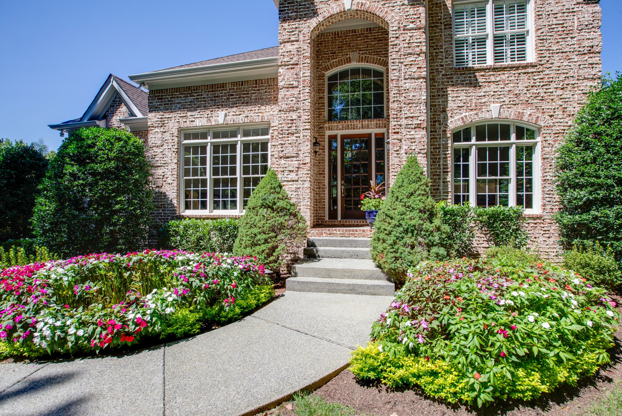 1106 Cedarview Lane Franklin, TN 37067 - Photo 2 of 28 front view of a house with a yard