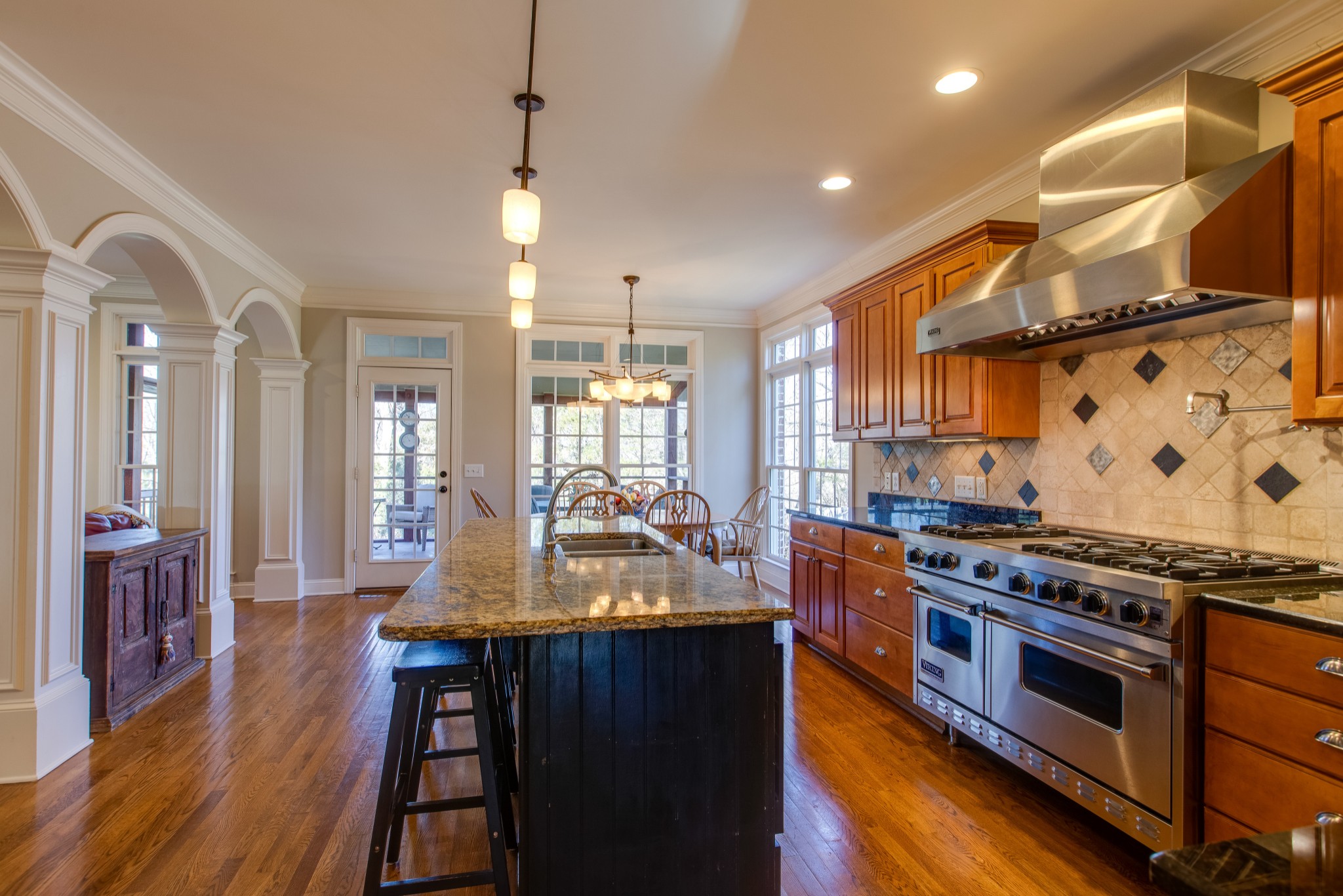 1106 Cedarview Lane Franklin, TN 37067 - Photo 9 of 28 a kitchen with stainless steel appliances granite countertop a stove and a wooden floors