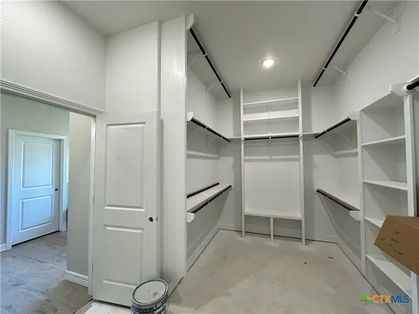 a view of an empty walk in closet