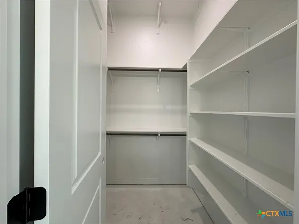 a view of an empty walk in closet