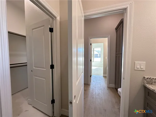 a view of a livingroom from a hallway