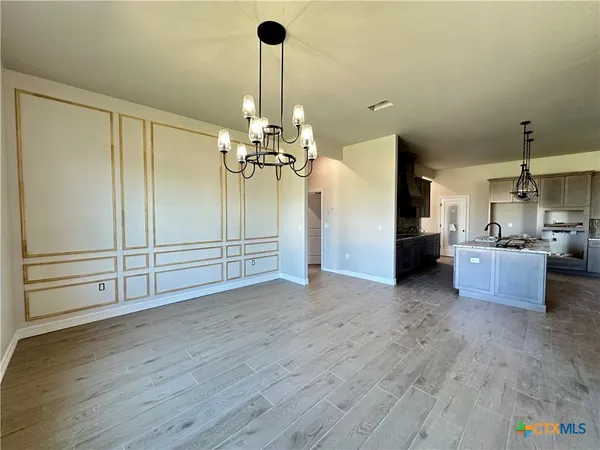 a view of a room with cabinet and stainless steel appliances