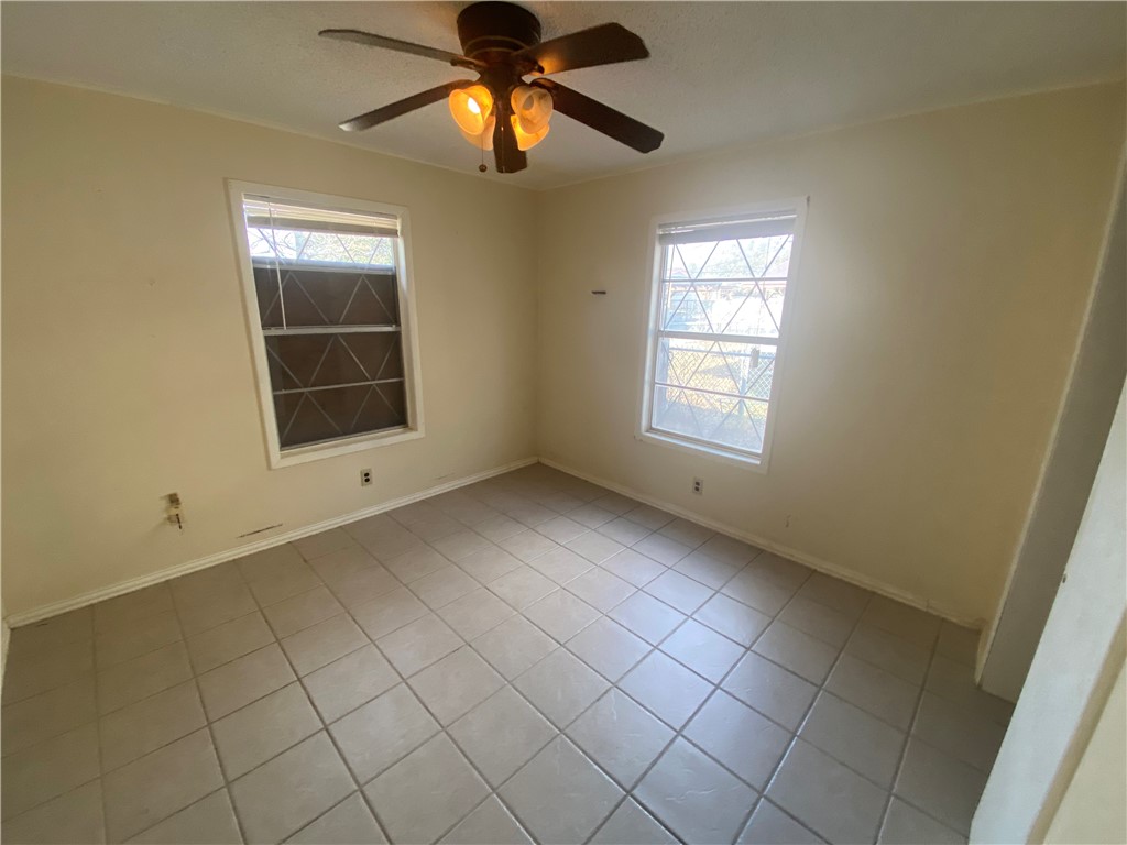 1015 Louis Street Alice, TX 78332 - Photo 12 of 20 a view of an empty room and window