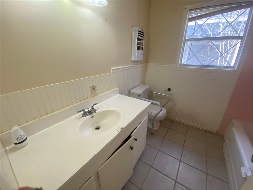 1015 Louis Street Alice, TX 78332 - Photo 13 of 20 a bathroom with a sink and a mirror