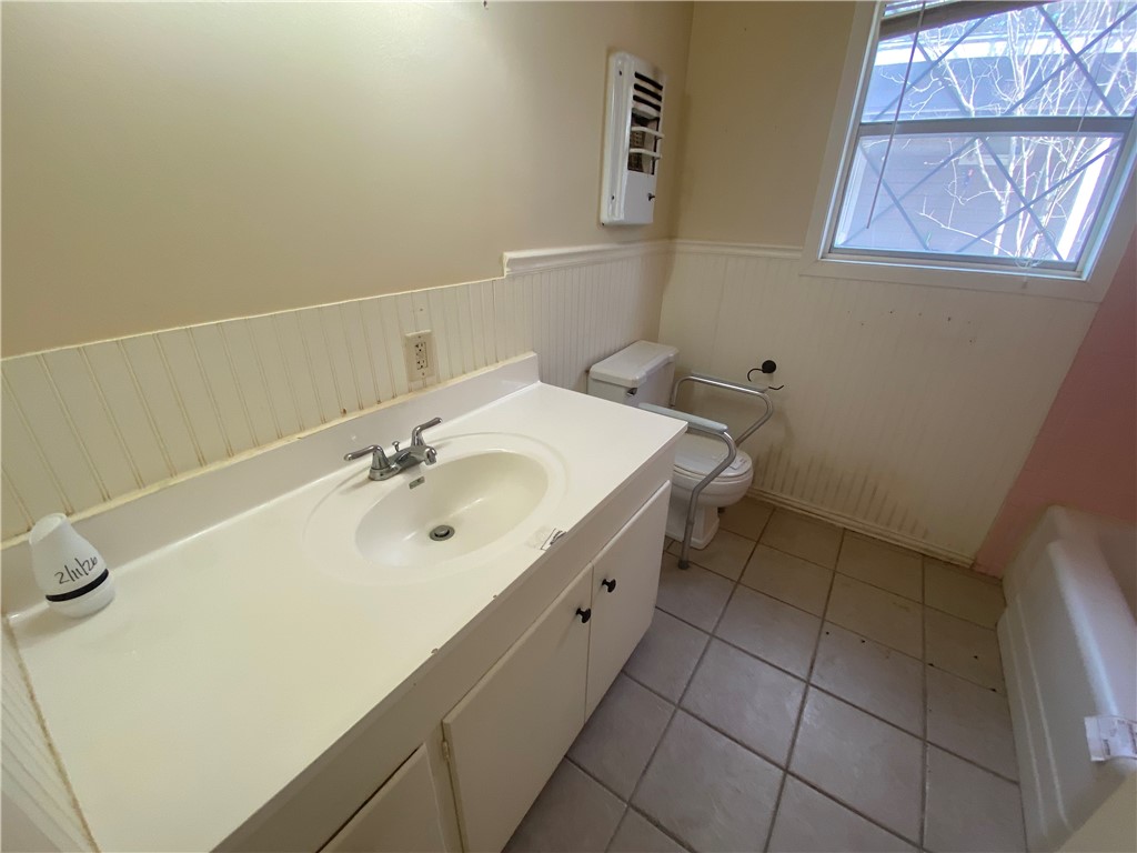 1015 Louis Street Alice, TX 78332 - Photo 14 of 20 a bathroom with a sink and a mirror
