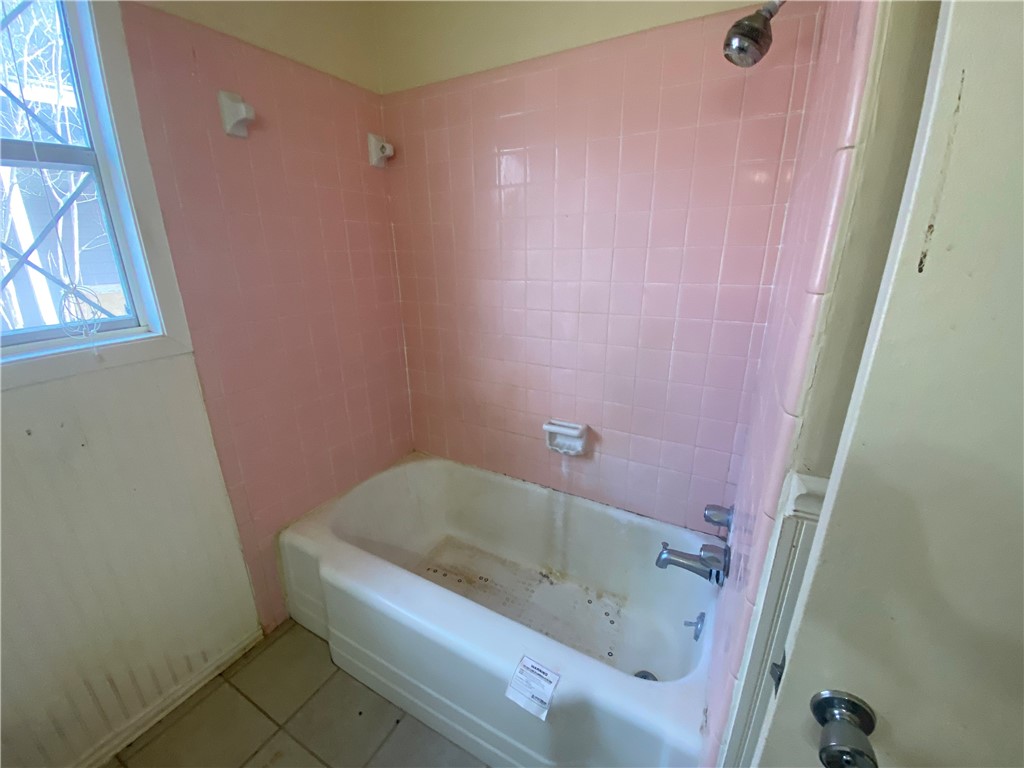 1015 Louis Street Alice, TX 78332 - Photo 15 of 20 a bath tub sitting next to a small sink