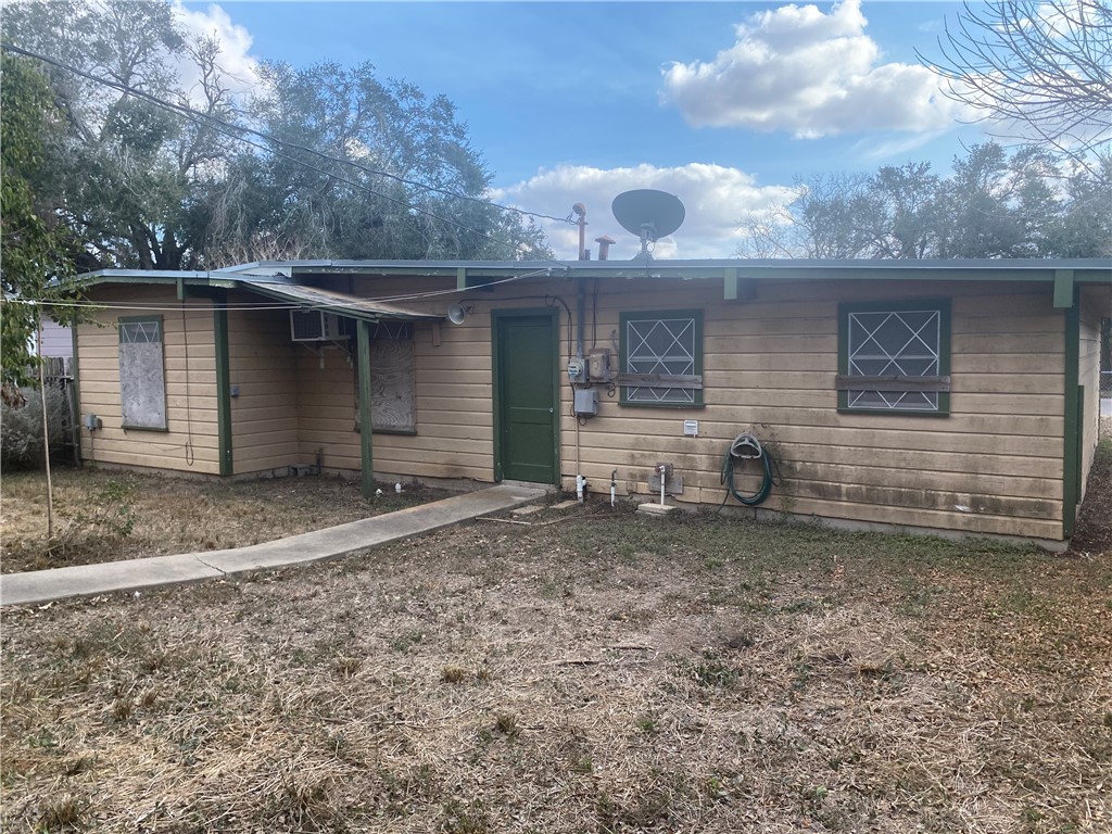 1015 Louis Street Alice, TX 78332 - Photo 18 of 20 a view of a house with a yard and garage
