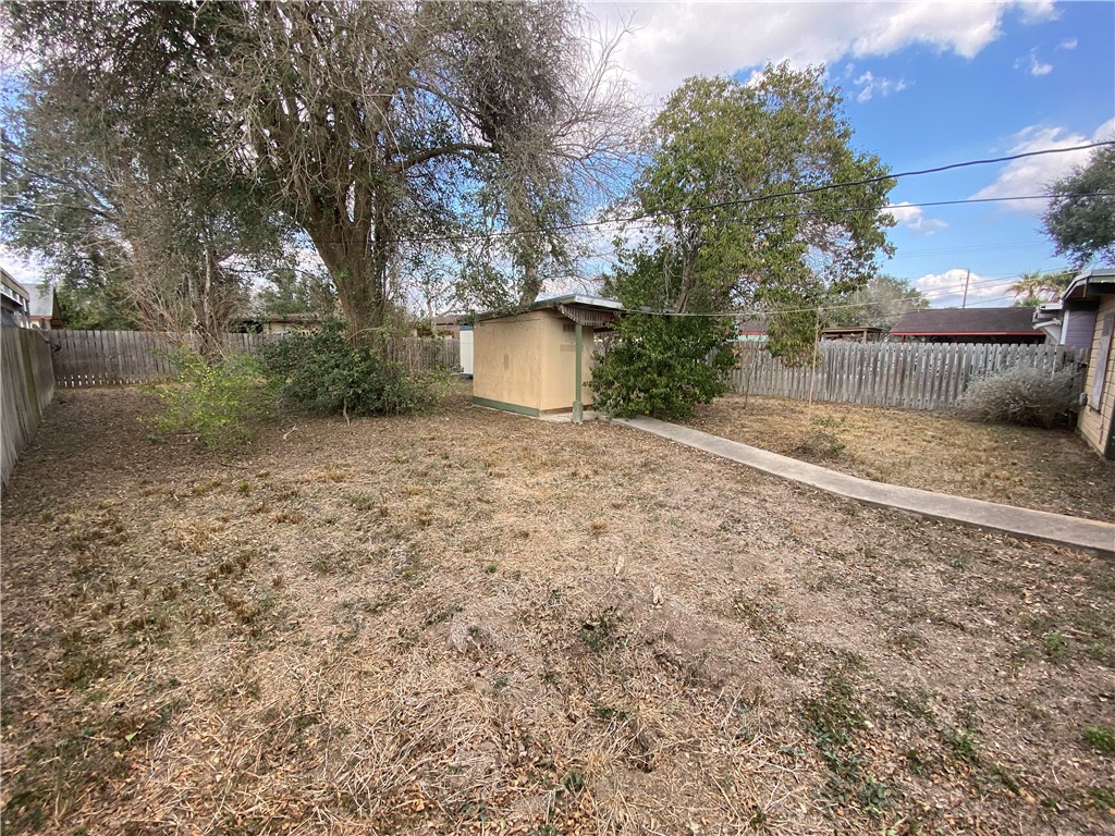 1015 Louis Street Alice, TX 78332 - Photo 19 of 20 a backyard of a house with lots of green space
