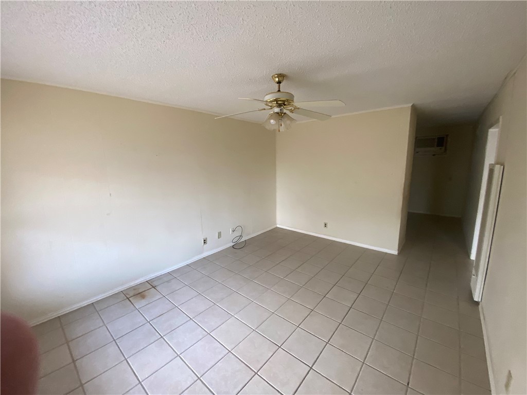 1015 Louis Street Alice, TX 78332 - Photo 6 of 20 wooden floor in an empty room with a window