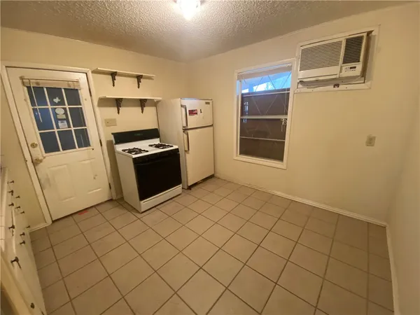 a view of a storage & utility room with cabinets