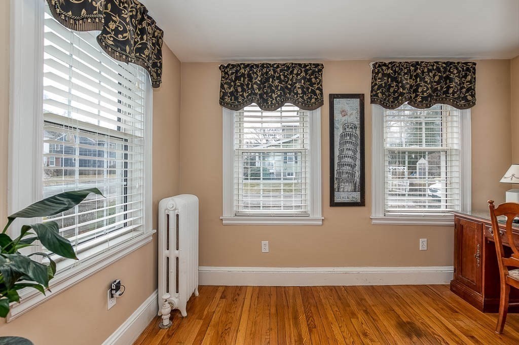 409 Mt Vernon Street Dedham, MA 02026 - Photo 12 of 42 a living room with furniture and a window