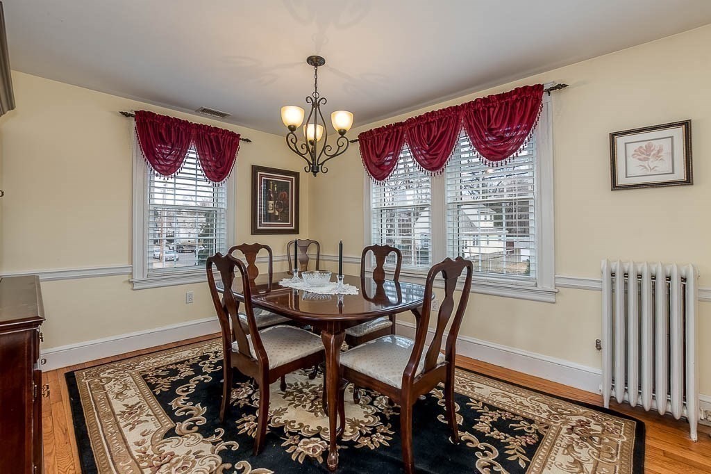 409 Mt Vernon Street Dedham, MA 02026 - Photo 14 of 42 a view of a dining room with furniture window and wooden floor