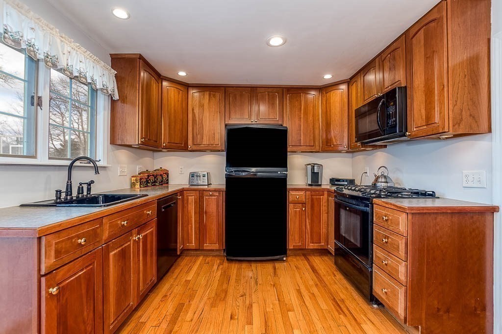 409 Mt Vernon Street Dedham, MA 02026 - Photo 16 of 42 a kitchen with granite countertop stainless steel appliances a refrigerator stove top oven and sink