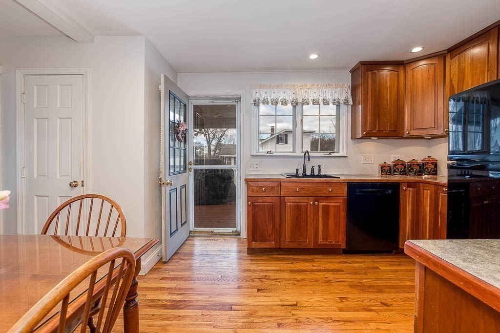 409 Mt Vernon Street Dedham, MA 02026 - Photo 18 of 42 a kitchen with stainless steel appliances granite countertop a refrigerator a stove top oven a sink and dishwasher