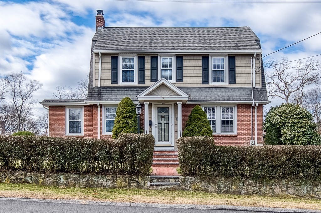 409 Mt Vernon Street Dedham, MA 02026 - Photo 2 of 42 a front view of a house with garden