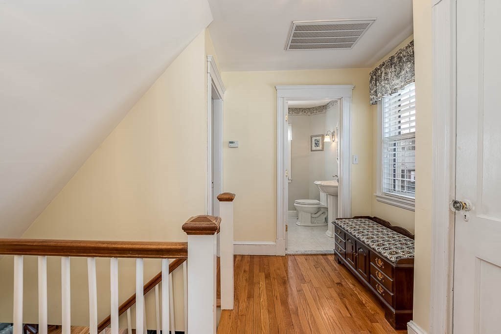 409 Mt Vernon Street Dedham, MA 02026 - Photo 21 of 42 a view of a hallway view with wooden floor and staircase