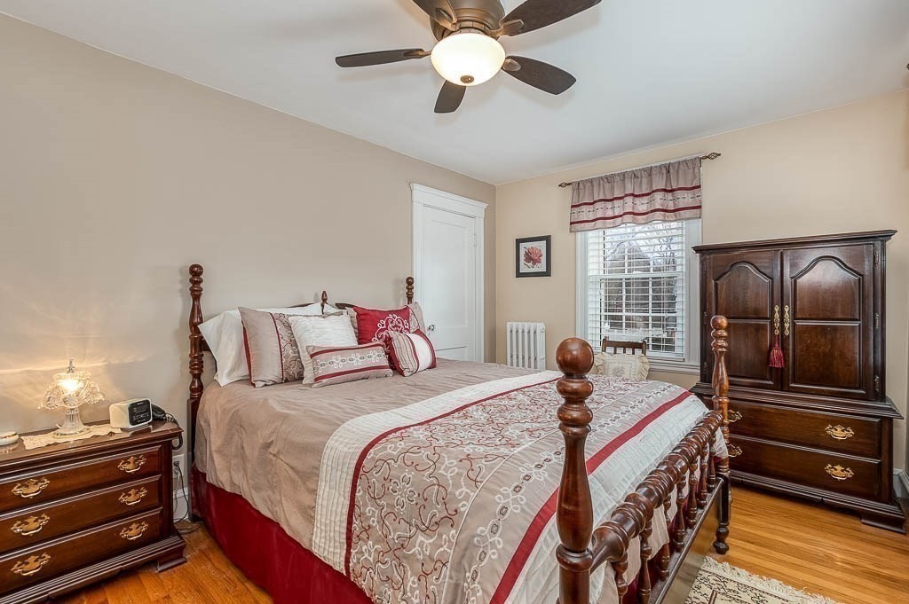 409 Mt Vernon Street Dedham, MA 02026 - Photo 23 of 42 a bedroom with bed and wooden floor