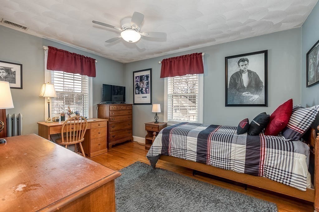 409 Mt Vernon Street Dedham, MA 02026 - Photo 26 of 42 a bedroom with furniture and a window