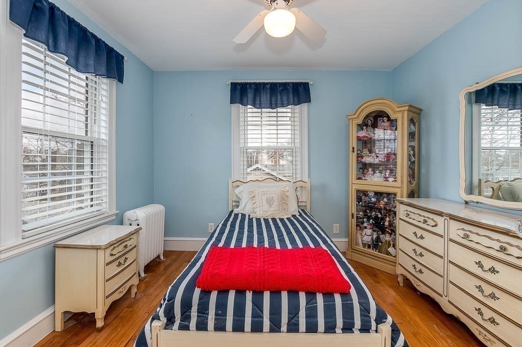 409 Mt Vernon Street Dedham, MA 02026 - Photo 28 of 42 a bedroom with furniture and a large window