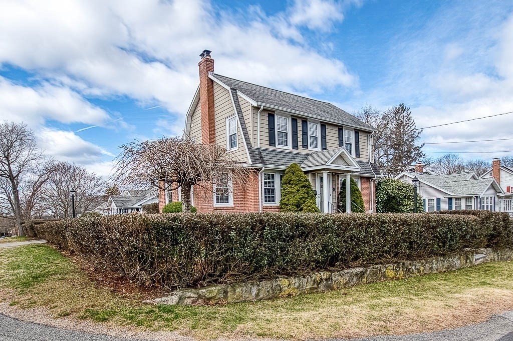 409 Mt Vernon Street Dedham, MA 02026 - Photo 3 of 42 a front view of a house with a yard